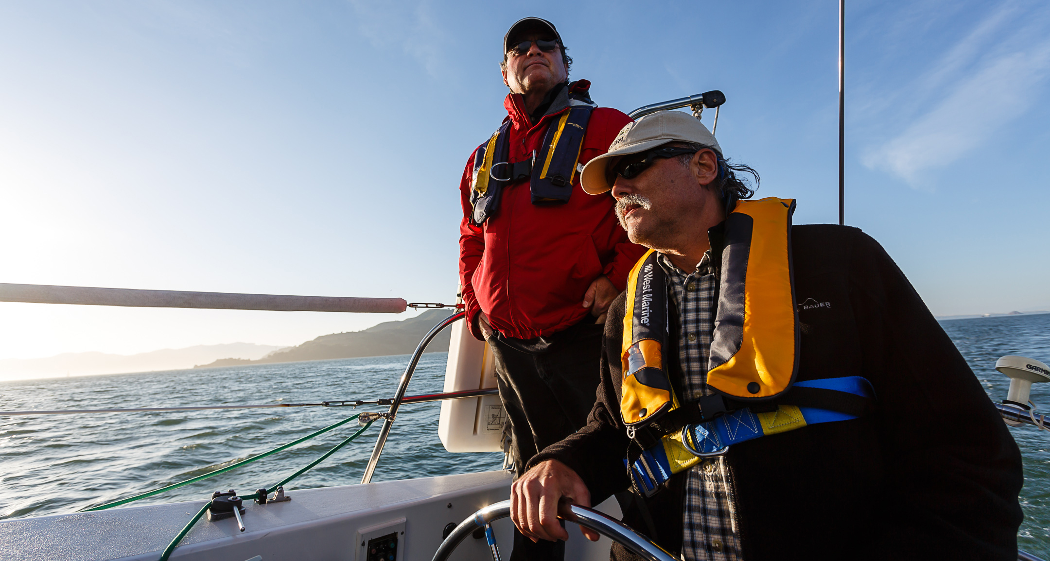 Modern Sailing Member Chuck takes the helm during an ASA 104 Bareboat Cruising Course with Modern Sailing School & Club and Instructor JT Meade