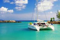 A Luxury Catamaran sits at anchor in a Caribbean Lagoon on an adventure sailing trip with Modern Sailing School and Club and Global Destination.