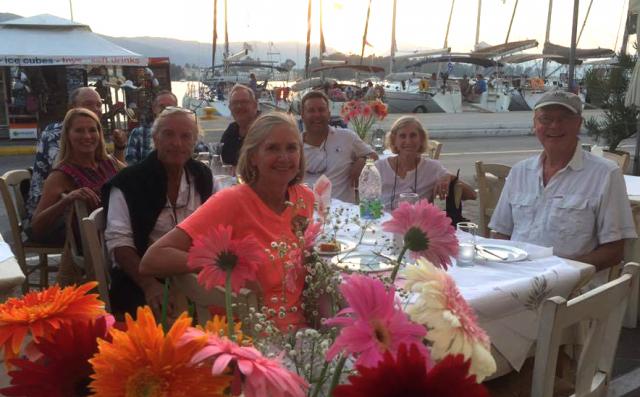 Participants  on Leg One of the Greece Modern Sailing Destinations Trip enjoy a group meal together at one of the many taverns.