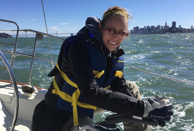 Sailing Student trims the sail during a Basic Coastal Cruising Sailing Lesson on San Francisco Bay with Modern Sailing School and Club